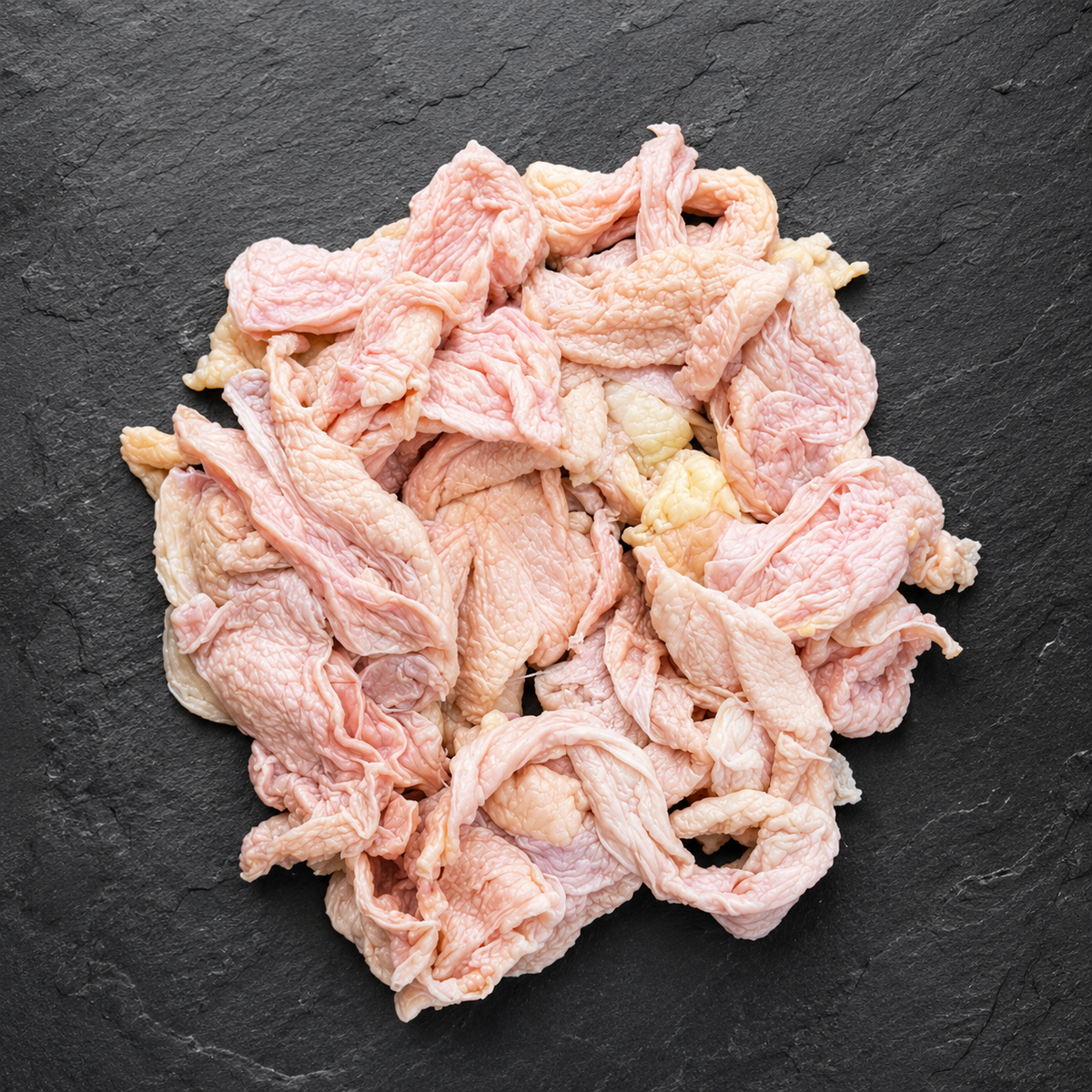 Chicken skin on dark surface 