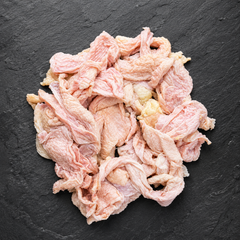 Chicken skin on dark surface 
