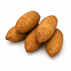 Five brown fried dough balls known as Kibbeh on a white background